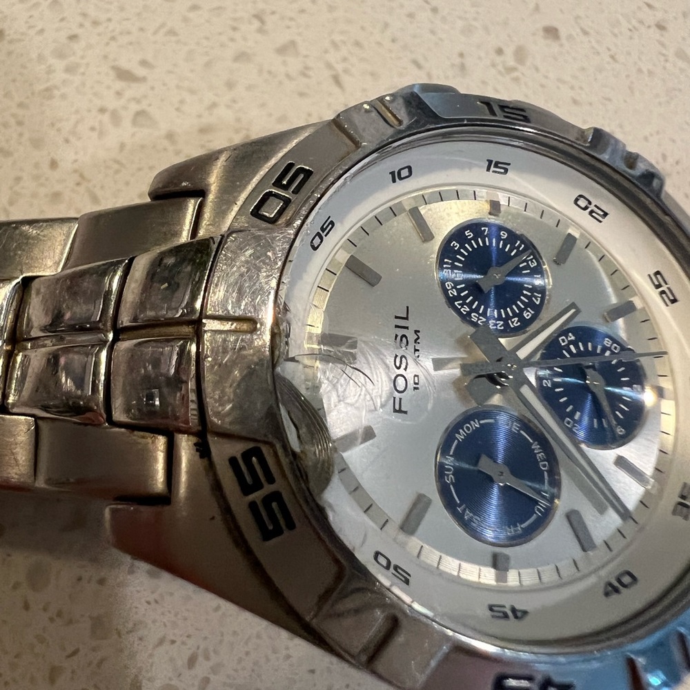 Men’s Fossil watch, silver usual scratches from wear and tear.